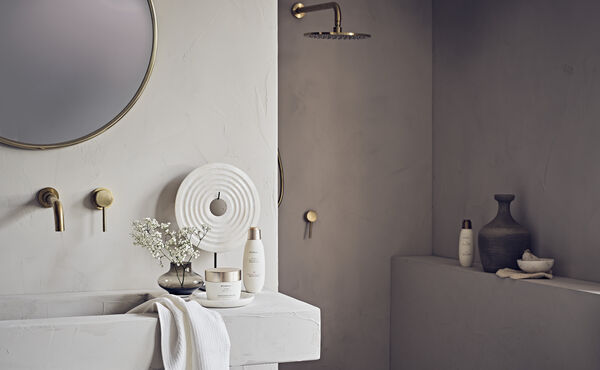 bathroom sink and shower with Rituals products